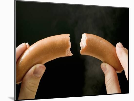 Hands Holding a Halved Frankfurter-null-Mounted Photographic Print