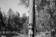 Woman Stands With Her Arms Wrapped Around A Ponderosa Pine Tree Looking Up And Smiling-Hannah Dewey-Photographic Print