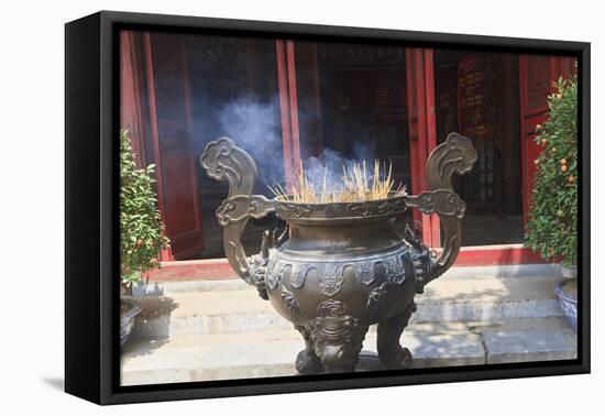 Hanoi, Vietnam. Incense offering at Ngoc Son Pagoda, a Buddhist temple-Yvette Cardozo-Framed Premier Image Canvas