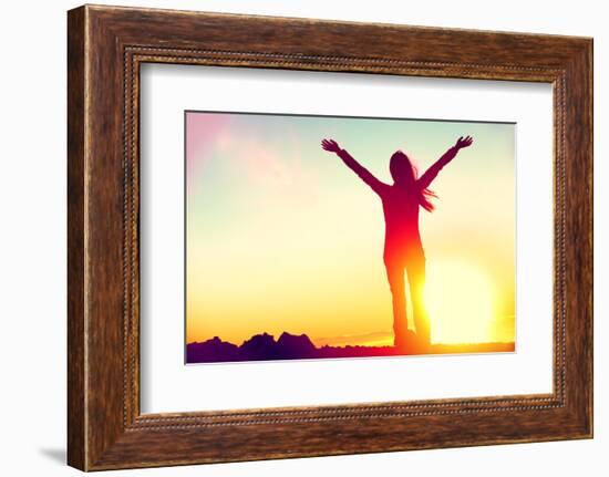 Happy Celebrating Winning Success Woman at Sunset or Sunrise Standing Elated with Arms Raised up Ab-Maridav-Framed Photographic Print