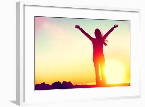 Happy Celebrating Winning Success Woman at Sunset or Sunrise Standing Elated with Arms Raised up Ab-Maridav-Framed Photographic Print