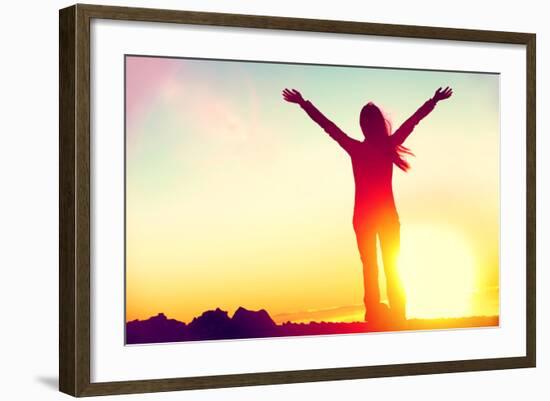 Happy Celebrating Winning Success Woman at Sunset or Sunrise Standing Elated with Arms Raised up Ab-Maridav-Framed Photographic Print