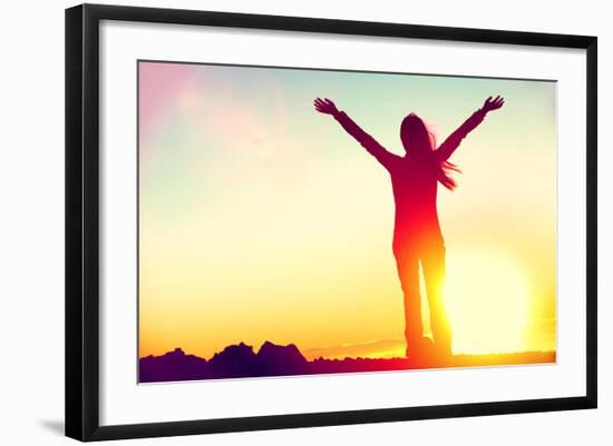 Happy Celebrating Winning Success Woman at Sunset or Sunrise Standing Elated with Arms Raised up Ab-Maridav-Framed Photographic Print