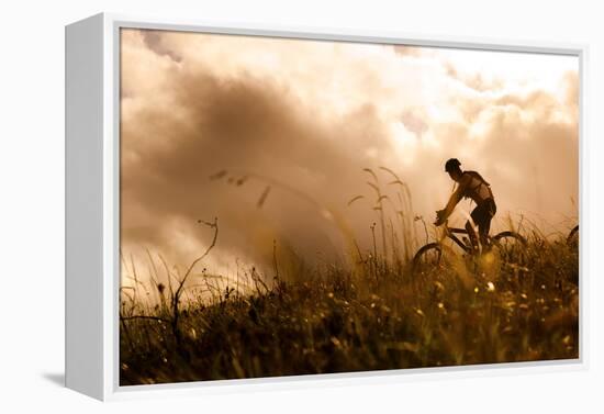 Happy Couple Riding Bicycles Outside, Healthy Lifestyle Fun Concept. Silhouette at Sunset Panoramic-warrengoldswain-Framed Premier Image Canvas