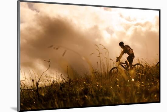 Happy Couple Riding Bicycles Outside, Healthy Lifestyle Fun Concept. Silhouette at Sunset Panoramic-warrengoldswain-Mounted Photographic Print