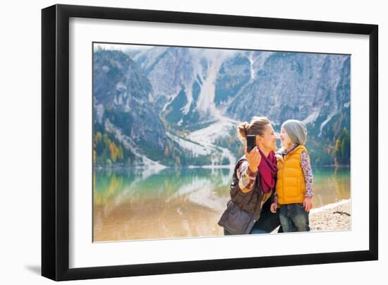Happy Mother and Baby Making Selfie on Lake Braies in South Tyrol, Italy-Mr Alliance-Framed Photographic Print