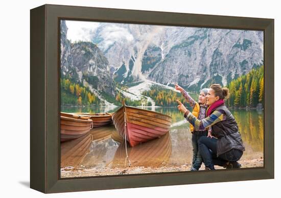 Happy Mother and Baby Pointing on Copy Space While on Lake Braies in South Tyrol, Italy-Mr Alliance-Framed Premier Image Canvas