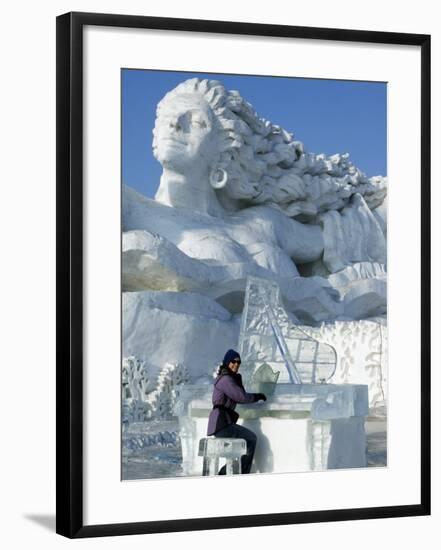 Harbin City, A Tourist Is Playing a Sculpted Ice Piano, Snow and Ice Festival, China-Christian Kober-Framed Photographic Print