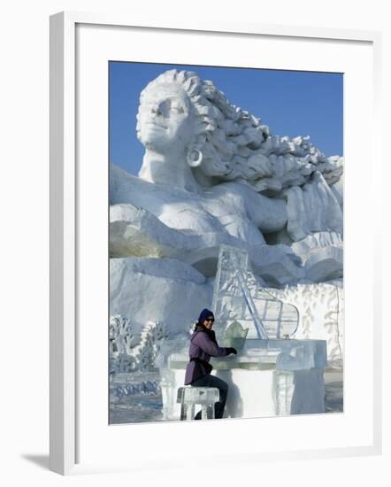 Harbin City, A Tourist Is Playing a Sculpted Ice Piano, Snow and Ice Festival, China-Christian Kober-Framed Photographic Print