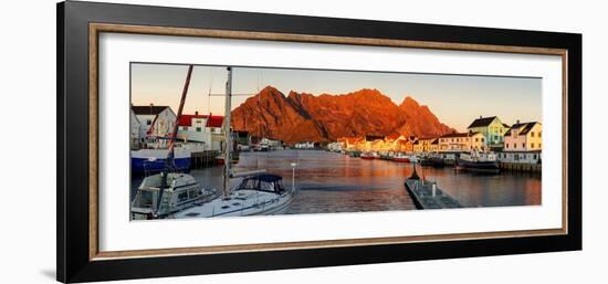 Harbor and village of Henningsvaer at sunset with mountains on background, Lofoten Islands-Roberto Moiola-Framed Photographic Print