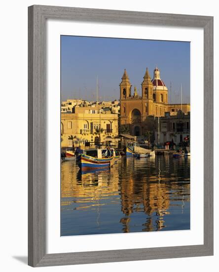 Harbour with Luzzu Fishing Boats and Marsaxlokk Parish Church at Sunrise, Marsaxlokk, Malta, Medite-Stuart Black-Framed Photographic Print