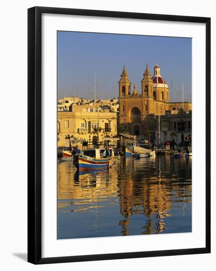 Harbour with Luzzu Fishing Boats and Marsaxlokk Parish Church at Sunrise, Marsaxlokk, Malta, Medite-Stuart Black-Framed Photographic Print
