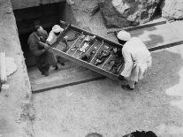 Removing a chariot wheel from the Tomb of Tutankhamun, Valley of the Kings, Egypt, 1922-Harry Burton-Photographic Print