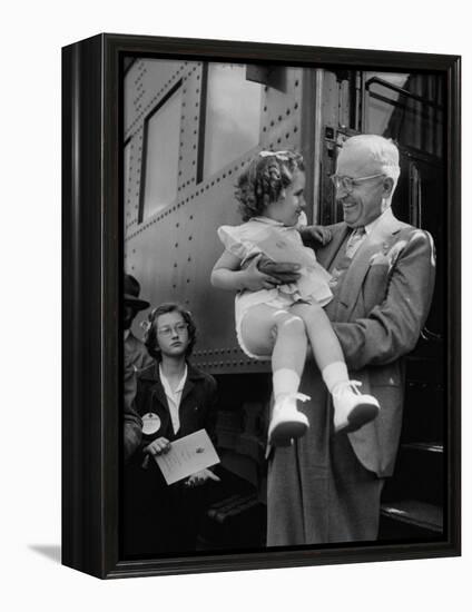 Harry Truman Holding up 3 Yr Old Suzanne Bump after the Town's Postmaster Pressed Her into Service-Hank Walker-Framed Premier Image Canvas