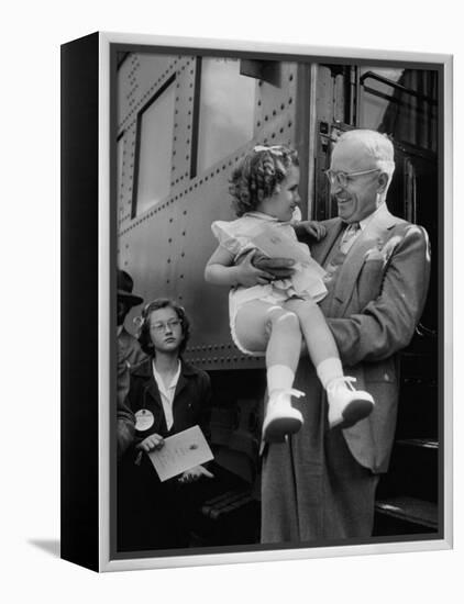 Harry Truman Holding up 3 Yr Old Suzanne Bump after the Town's Postmaster Pressed Her into Service-Hank Walker-Framed Premier Image Canvas