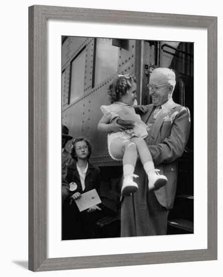 Harry Truman Holding up 3 Yr Old Suzanne Bump after the Town's Postmaster Pressed Her into Service-Hank Walker-Framed Photographic Print