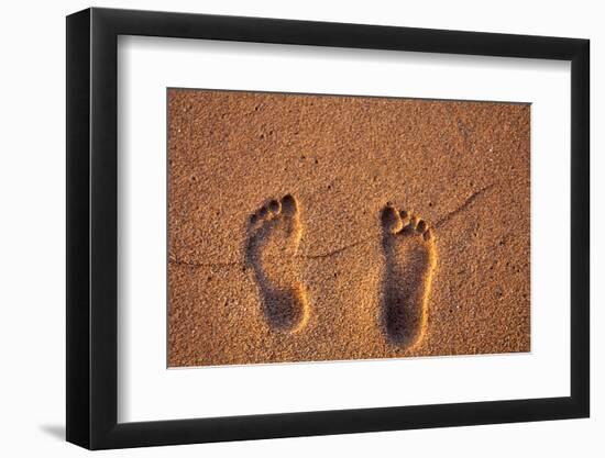 Hawaii, Kauai. Footprints in the sand on a Hawaii beach.-Janis Miglavs-Framed Photographic Print