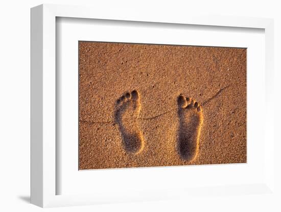 Hawaii, Kauai. Footprints in the sand on a Hawaii beach.-Janis Miglavs-Framed Photographic Print