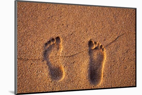 Hawaii, Kauai. Footprints in the sand on a Hawaii beach.-Janis Miglavs-Mounted Photographic Print