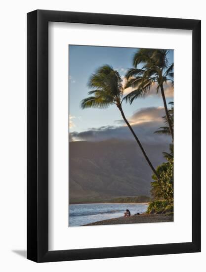 Hawaii, Maui, Kihei. Tourists walking under palm trees on Kalae Pohaku beach.-Janis Miglavs-Framed Photographic Print