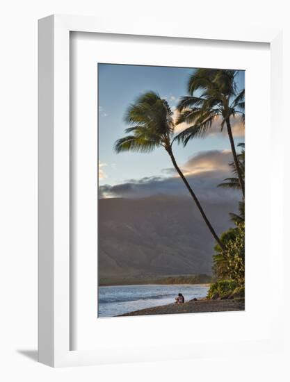 Hawaii, Maui, Kihei. Tourists walking under palm trees on Kalae Pohaku beach.-Janis Miglavs-Framed Photographic Print