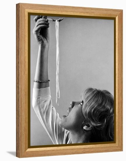 Hayley Mills Attempting to Eat Spaghetti-Ralph Crane-Framed Premier Image Canvas