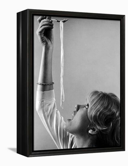 Hayley Mills Attempting to Eat Spaghetti-Ralph Crane-Framed Premier Image Canvas