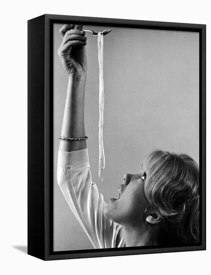 Hayley Mills Attempting to Eat Spaghetti-Ralph Crane-Framed Premier Image Canvas