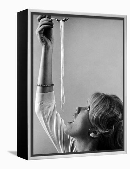 Hayley Mills Attempting to Eat Spaghetti-Ralph Crane-Framed Premier Image Canvas