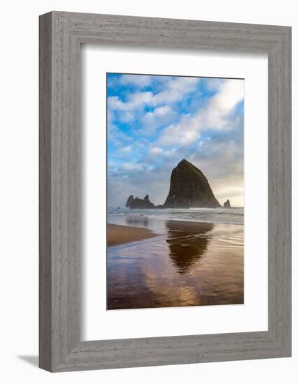 Haystack Rock reflected on the shoreline at Cannon Beach on the Pacific Northwest coast, Oregon, Un-Martin Child-Framed Photographic Print