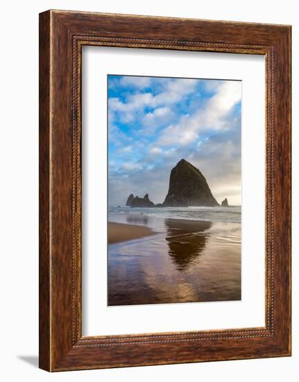 Haystack Rock reflected on the shoreline at Cannon Beach on the Pacific Northwest coast, Oregon, Un-Martin Child-Framed Photographic Print