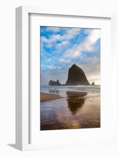 Haystack Rock reflected on the shoreline at Cannon Beach on the Pacific Northwest coast, Oregon, Un-Martin Child-Framed Photographic Print