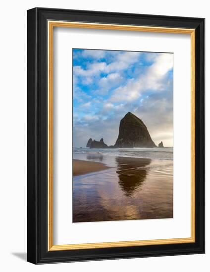 Haystack Rock reflected on the shoreline at Cannon Beach on the Pacific Northwest coast, Oregon, Un-Martin Child-Framed Photographic Print