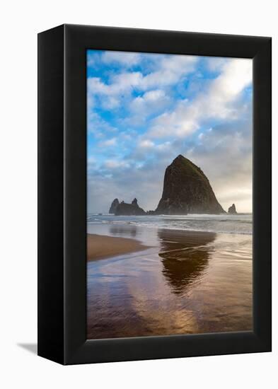 Haystack Rock reflected on the shoreline at Cannon Beach on the Pacific Northwest coast, Oregon, Un-Martin Child-Framed Premier Image Canvas