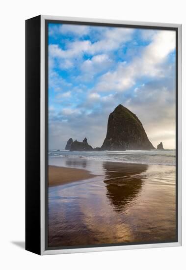 Haystack Rock reflected on the shoreline at Cannon Beach on the Pacific Northwest coast, Oregon, Un-Martin Child-Framed Premier Image Canvas