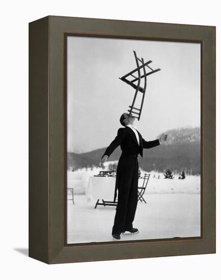 Head Waiter Rene Breguet Balancing Chair on Chin at Ice Rink of Grand Hotel-Alfred Eisenstaedt-Framed Premier Image Canvas