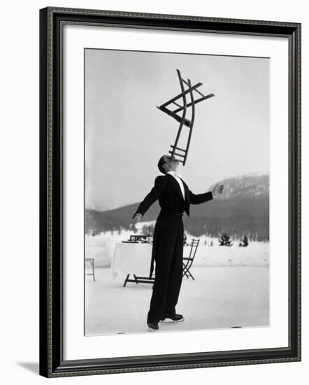 Head Waiter Rene Breguet Balancing Chair on Chin at Ice Rink of Grand Hotel-Alfred Eisenstaedt-Framed Premium Photographic Print