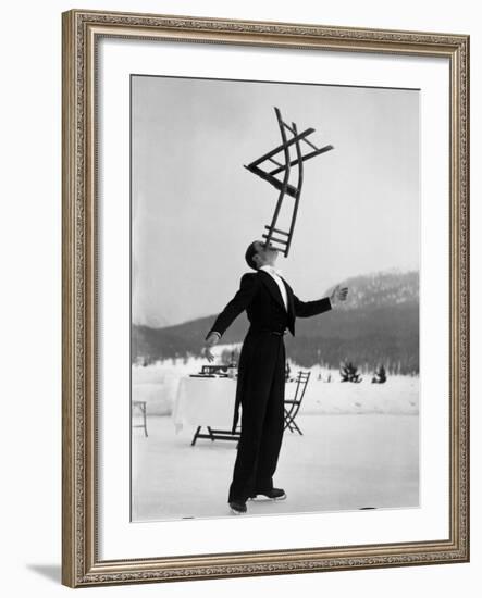 Head Waiter Rene Breguet Balancing Chair on Chin at Ice Rink of Grand Hotel-Alfred Eisenstaedt-Framed Premium Photographic Print