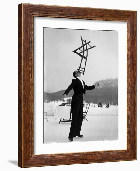 Head Waiter Rene Breguet Balancing Chair on Chin at Ice Rink of Grand Hotel-Alfred Eisenstaedt-Framed Photographic Print