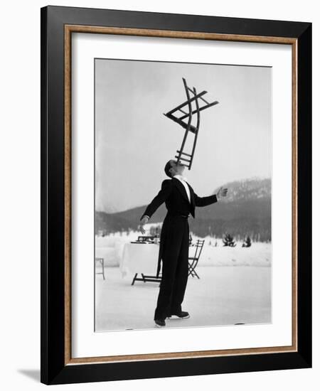 Head Waiter Rene Breguet Balancing Chair on Chin at Ice Rink of Grand Hotel-Alfred Eisenstaedt-Framed Photographic Print