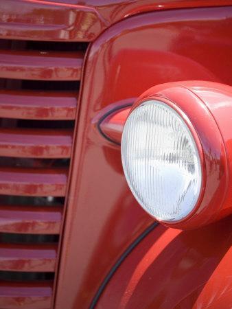'Headlight and Partial Grill of a Red Antique Truck' Photographic Print