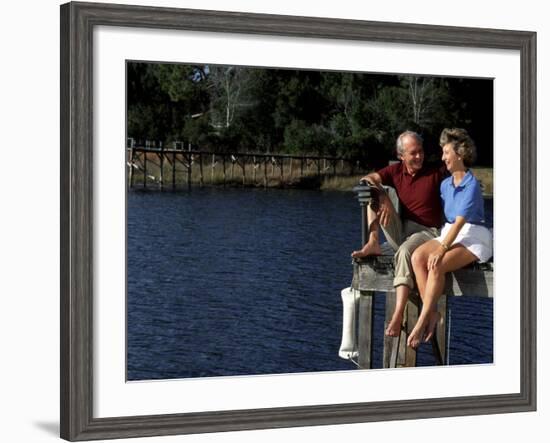 Healthy Couple Sitting on the Dock by a Lake-Bill Bachmann-Framed Photographic Print