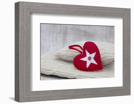 Heart cushions with star of Bethlehem as a token of love, still life-Andrea Haase-Framed Photographic Print