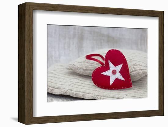 Heart cushions with star of Bethlehem as a token of love, still life-Andrea Haase-Framed Photographic Print