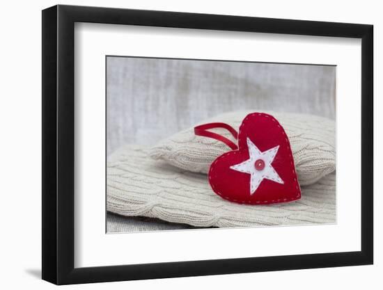 Heart cushions with star of Bethlehem as a token of love, still life-Andrea Haase-Framed Photographic Print