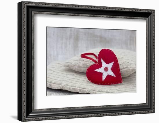 Heart cushions with star of Bethlehem as a token of love, still life-Andrea Haase-Framed Photographic Print