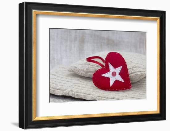 Heart cushions with star of Bethlehem as a token of love, still life-Andrea Haase-Framed Photographic Print