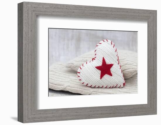 Heart cushions with star of Bethlehem as a token of love, still life-Andrea Haase-Framed Photographic Print