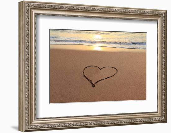 Heart in the Sand on the Beach at Sunset.-Hannamariah-Framed Photographic Print