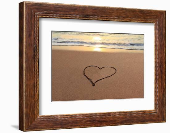 Heart in the Sand on the Beach at Sunset.-Hannamariah-Framed Photographic Print